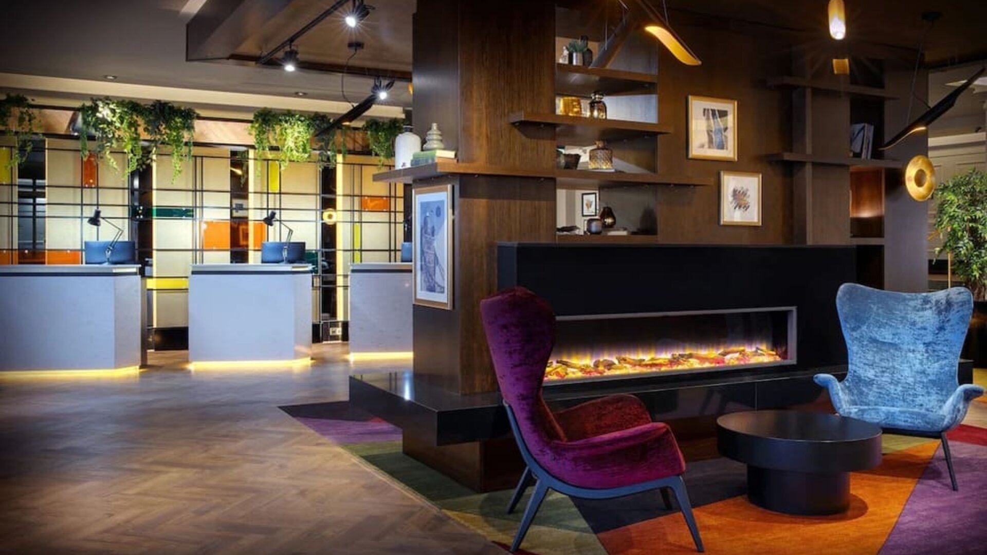 Lobby lounge with fireplace at Leonardo Royal Hotel London City.