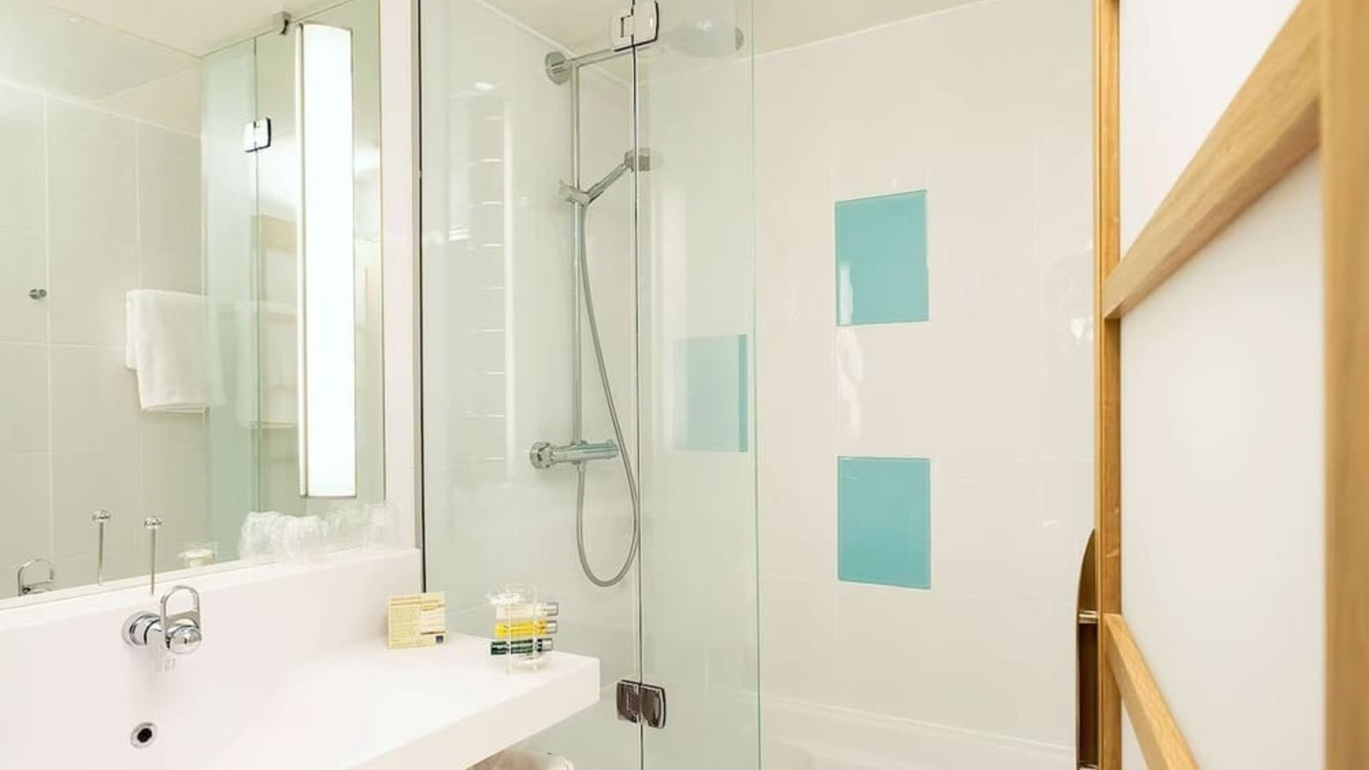 Guest bathroom with shower at Novotel Manchester West.