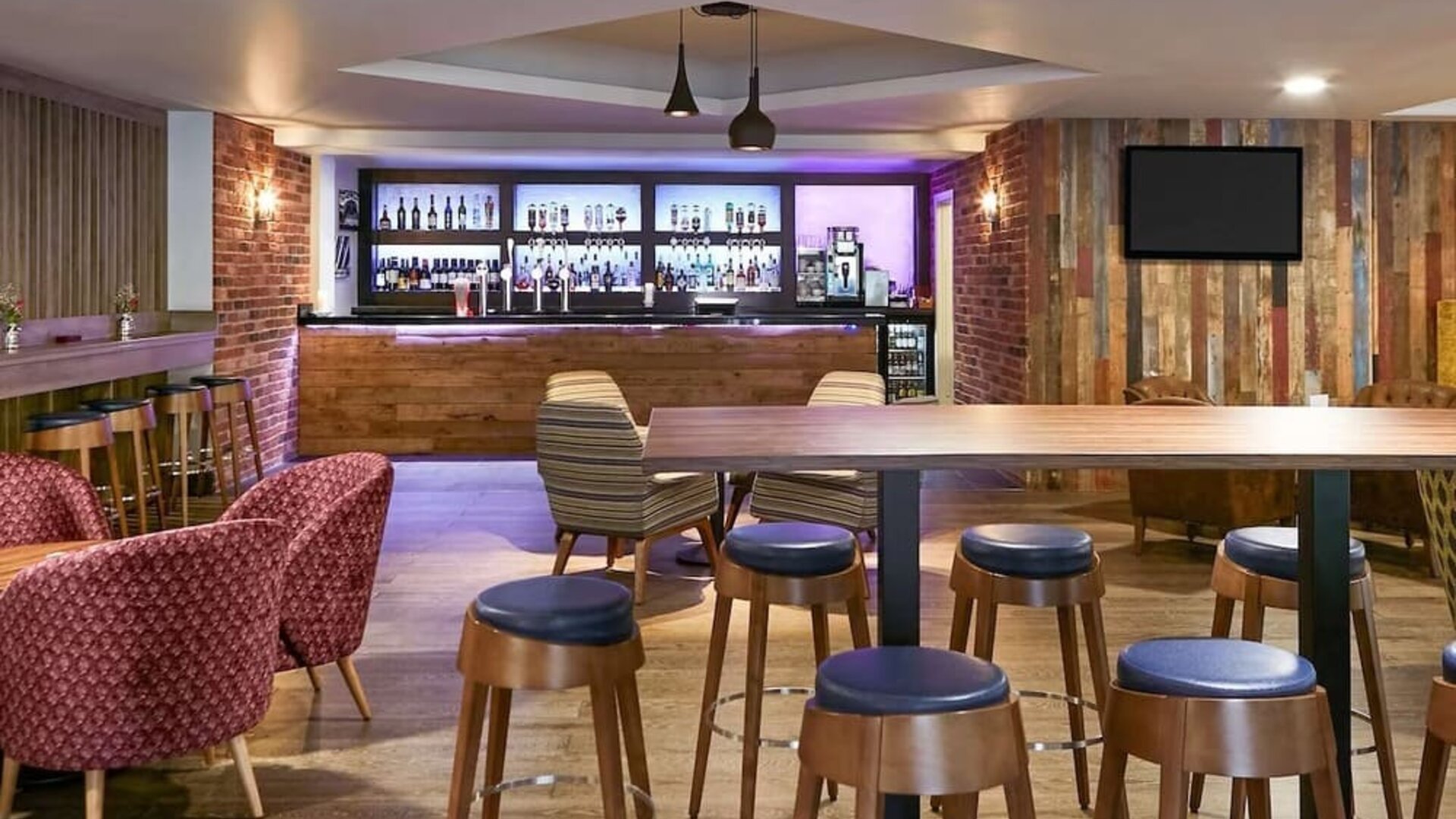Hotel bar with lounge seating at Novotel Manchester West.