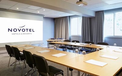 Professional meeting room with U shaped table at Novotel Manchester West.