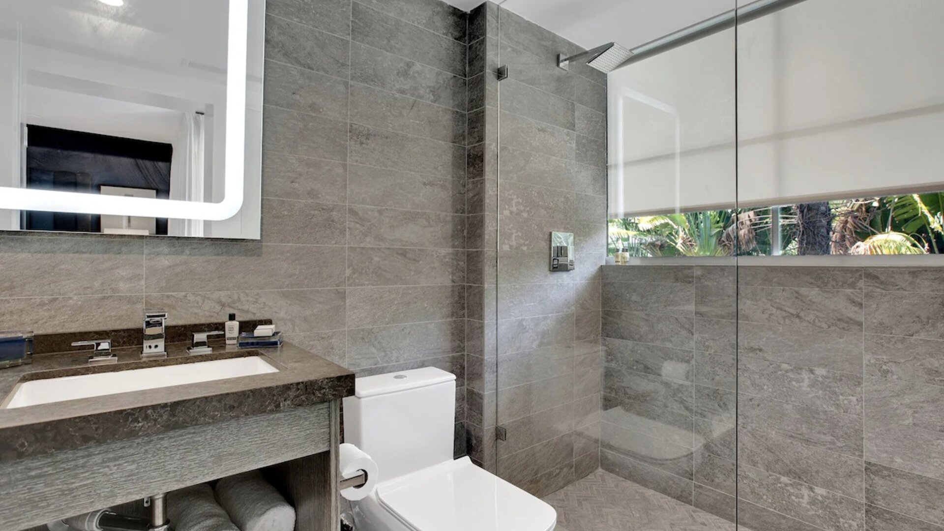 Guest bathroom with shower at The Sagamore Hotel South Beach.