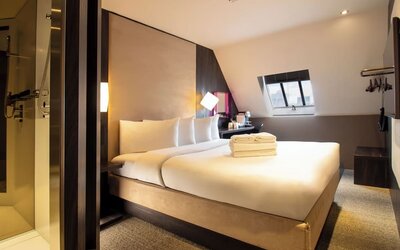 Day use room with king bed and private bathroom with shower at Bloc Hotel Birmingham.