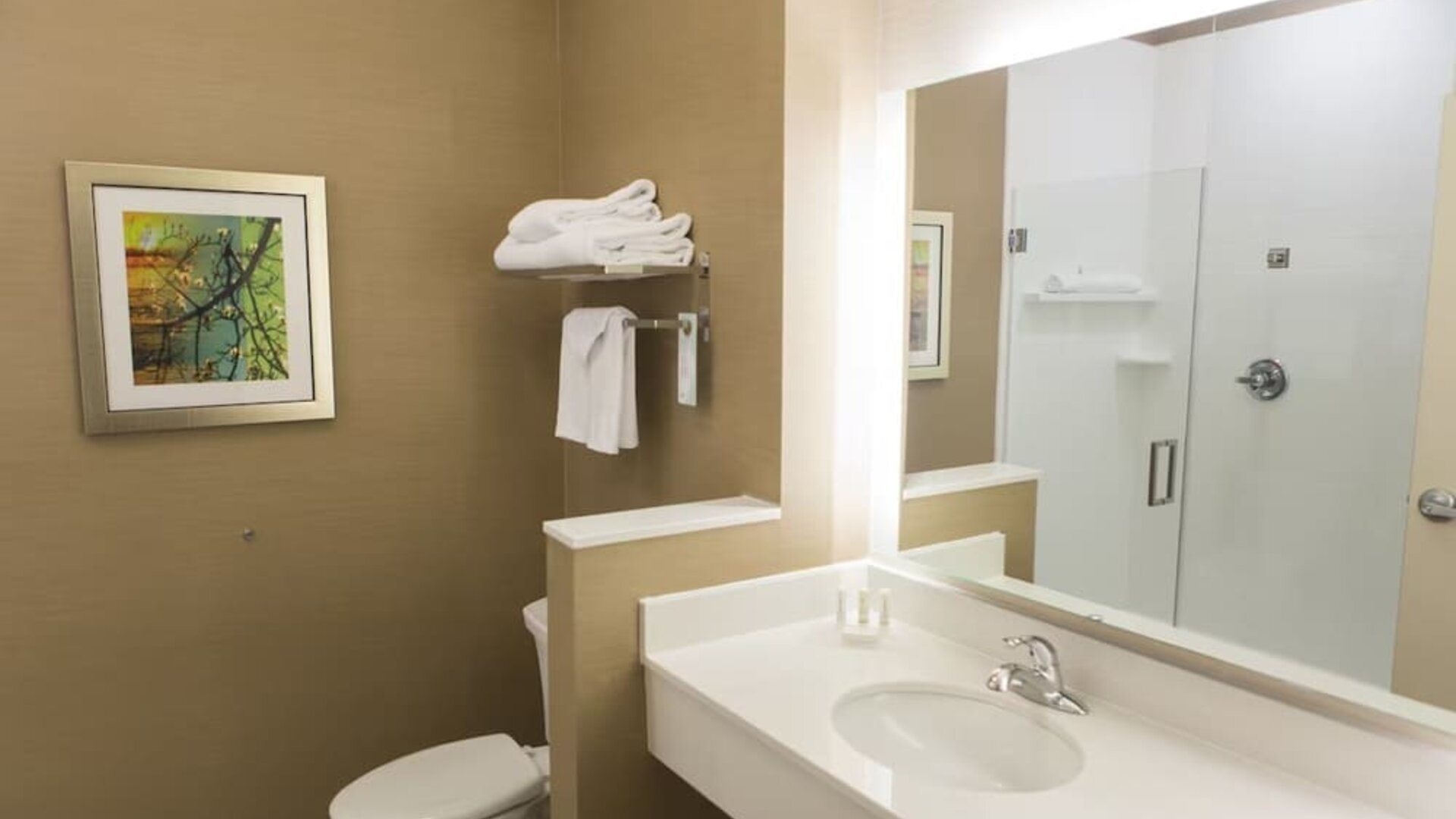 Guest bathroom with shower at Fairfield Inn And Suites Cambridge Ohio.