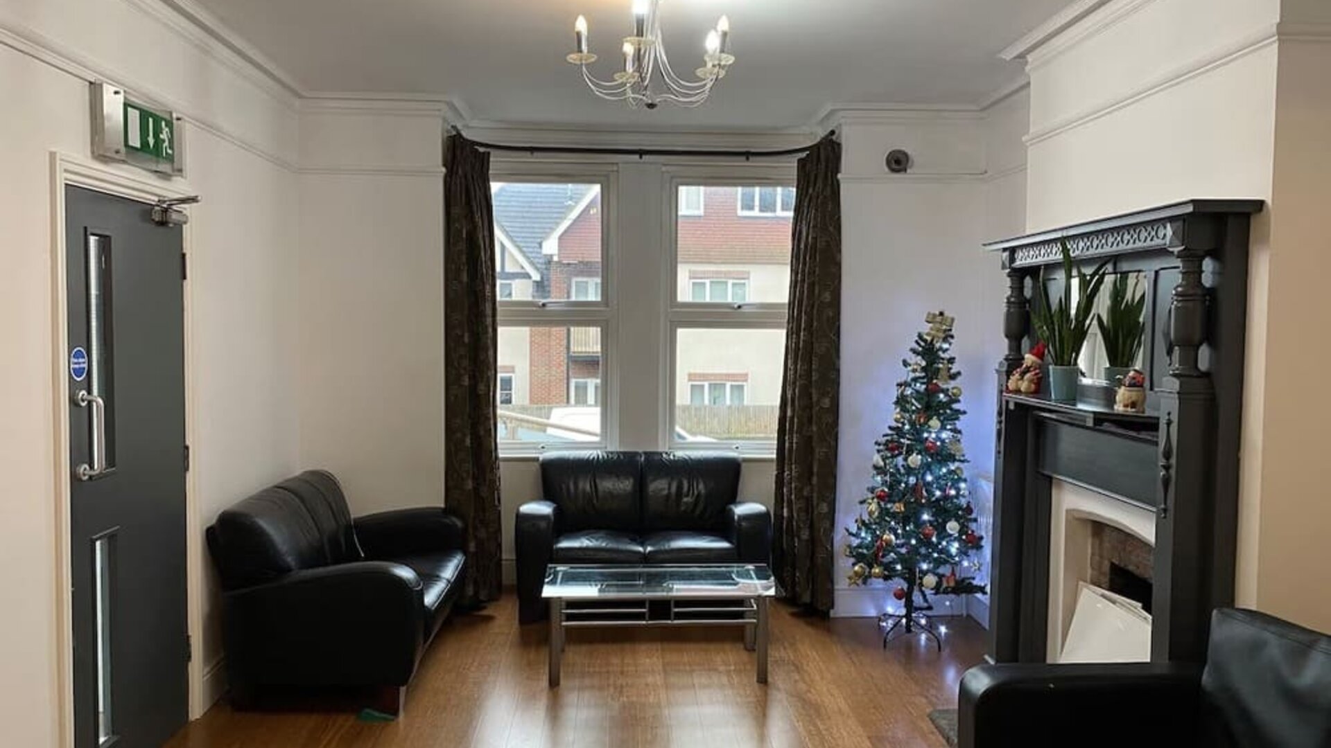 Lobby lounge with comfortable seating and fireplace at Buckingham Hotel.