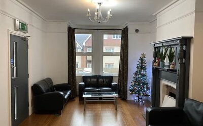 Lobby lounge with comfortable seating and fireplace at Buckingham Hotel.