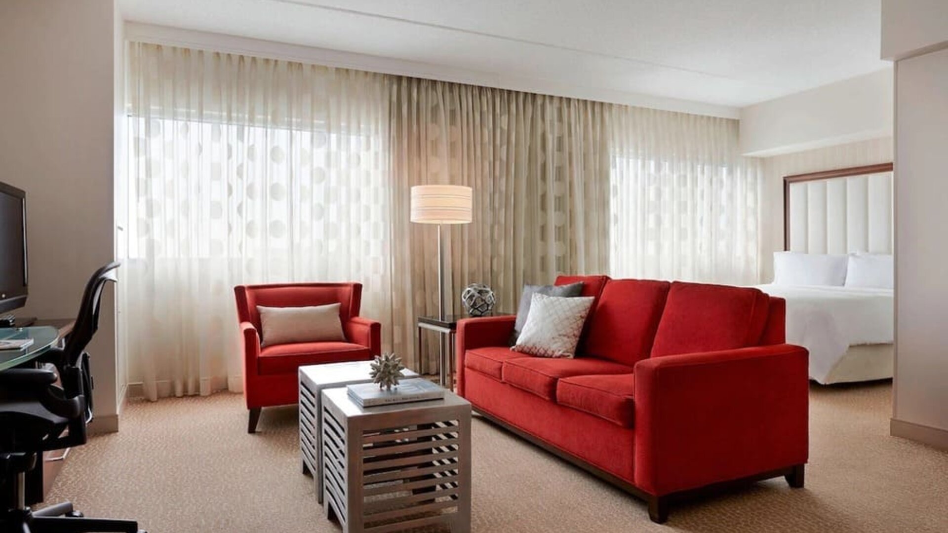 Day use room with sofa and work desk at Renaissance Newark Airport Hotel.