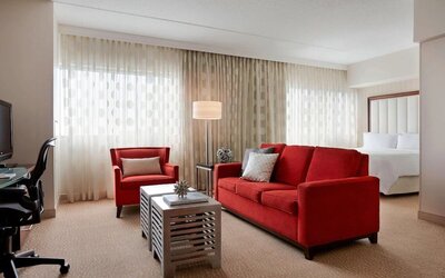 Day use room with sofa and work desk at Renaissance Newark Airport Hotel.