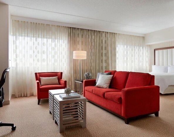 Day use room with sofa and work desk at Renaissance Newark Airport Hotel.