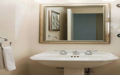 Guest bathroom with shower at Renaissance Newark Airport Hotel.