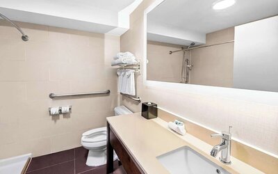 Guest bathroom with shower at Best Western Inn At Ramsey.