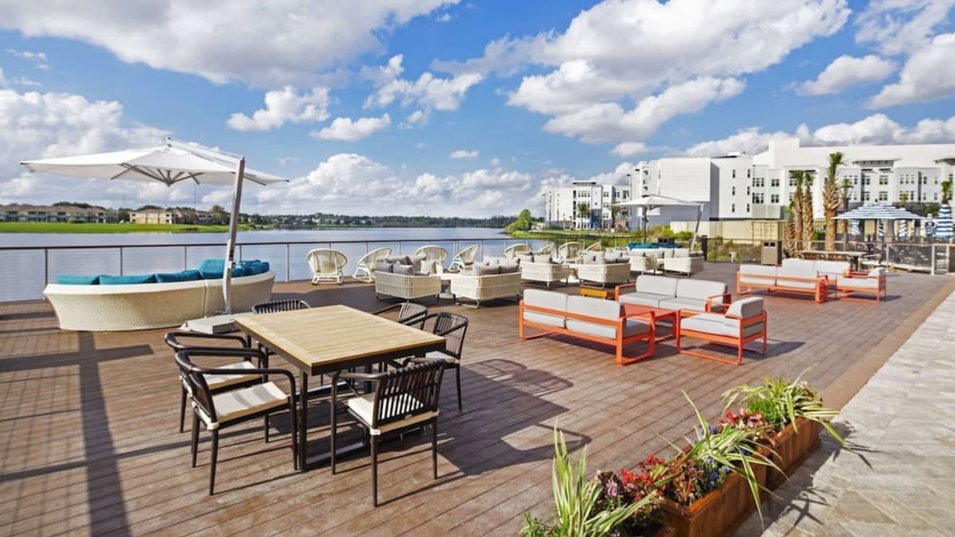 Outdoor furniture with an amazing view of the lake at Hyatt Place Jacksonville / St. Johns Town Center.