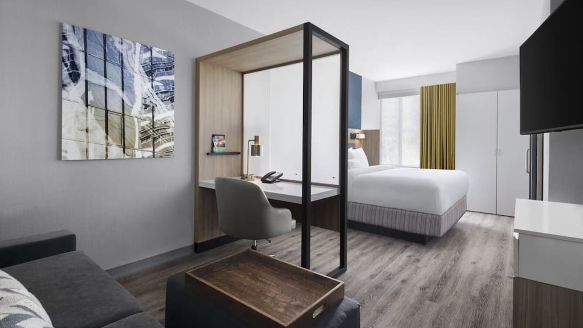 Day use room with sofa and work desk at SpringHill Suites Tuckahoe.