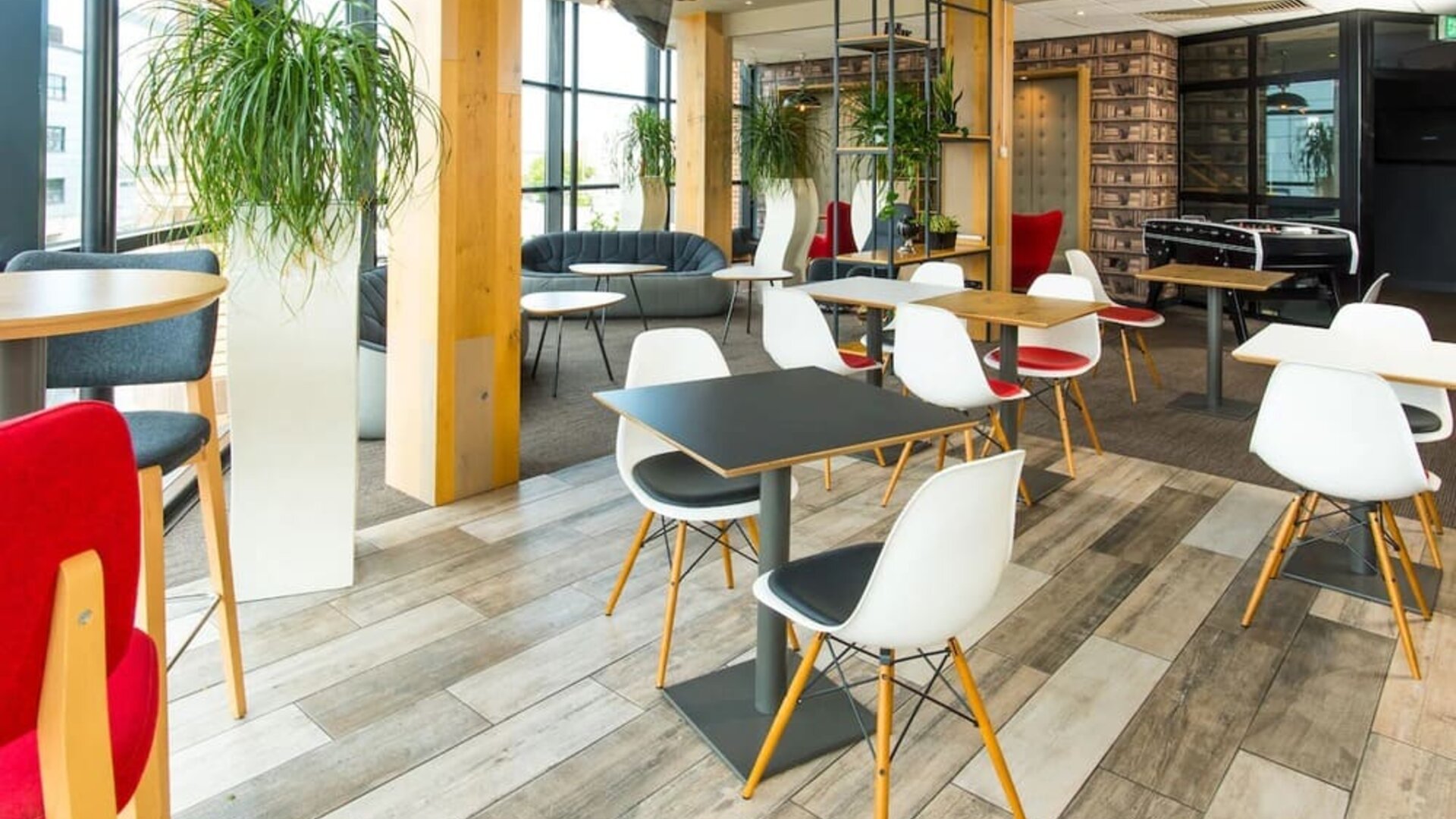 Comfortable lounge area with natural light at ibis Leicester City.