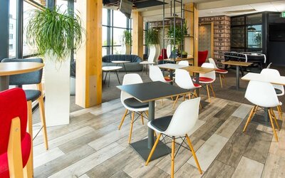 Comfortable lounge area with natural light at ibis Leicester City.