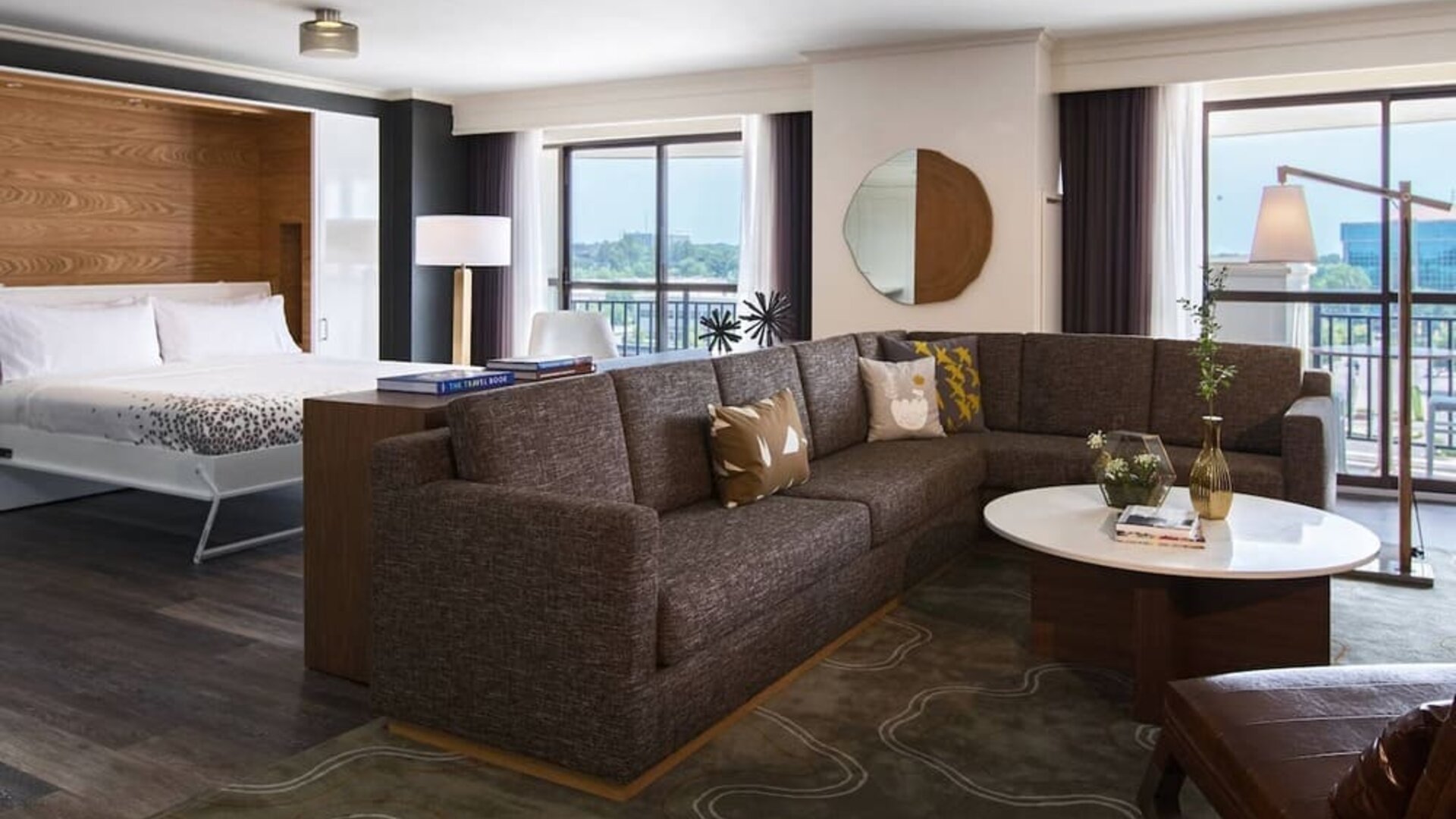 Day use room with living area and balcony at Renaissance Raleigh North Hills Hotel.