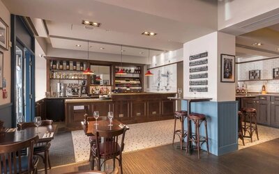 Hotel bar and dining area at Mercure London Hyde Park Hotel.
