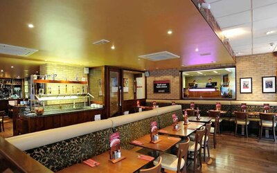 Dining area with comfortable seating at Mercure London Paddington Hotel.
