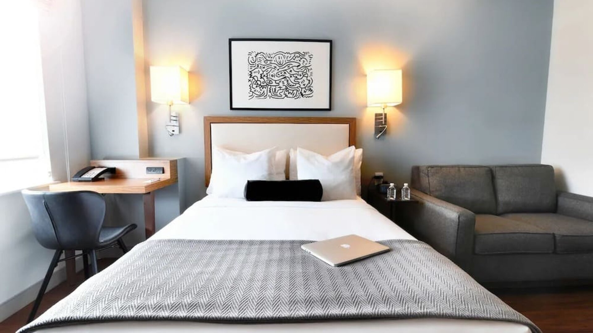 Day use room with sofa and work desk at Edge Hotel NYC.