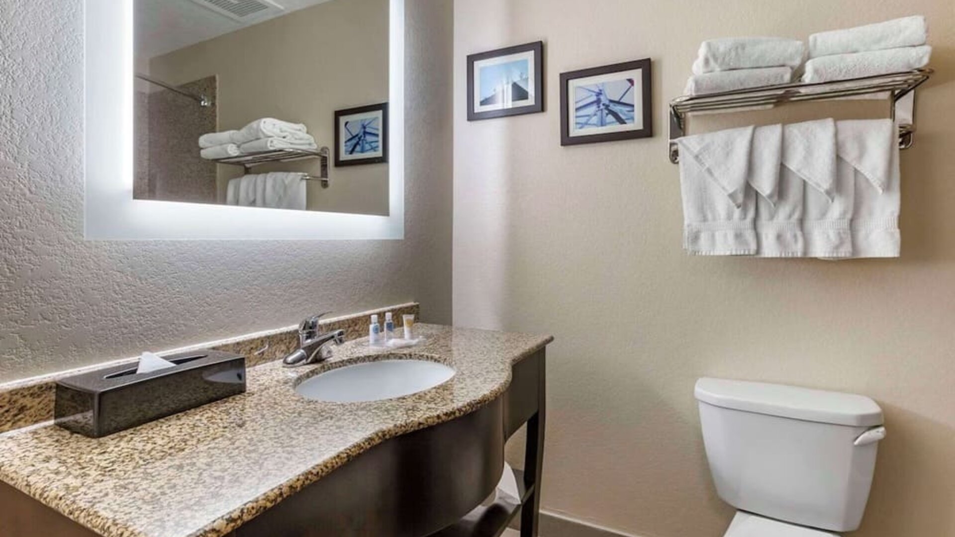Guest bathroom with shower at Comfort Suites Phoenix Airport.