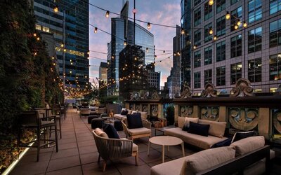 Rooftop terrace seating at The Knickerbocker Hotel.
