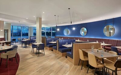 Dining area at Hyatt Place London Heathrow Airport.