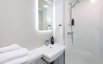 Private guest bathroom with shower at Ibis Plymouth.