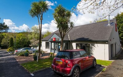 Hotel entrance and parking area at Ibis Plymouth.