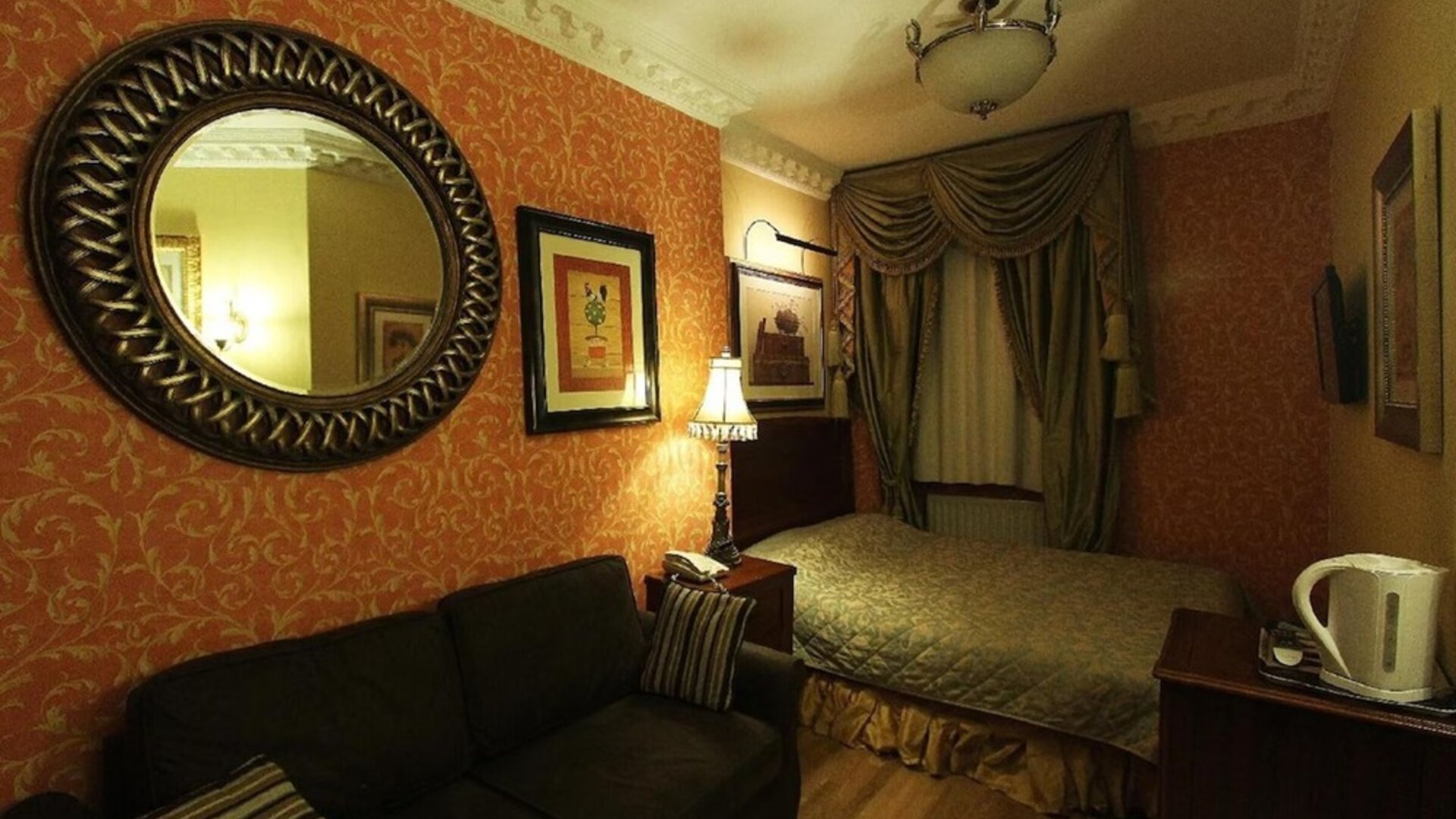 Day use room with queen bed and sofa at Opulence Central London Hotel.