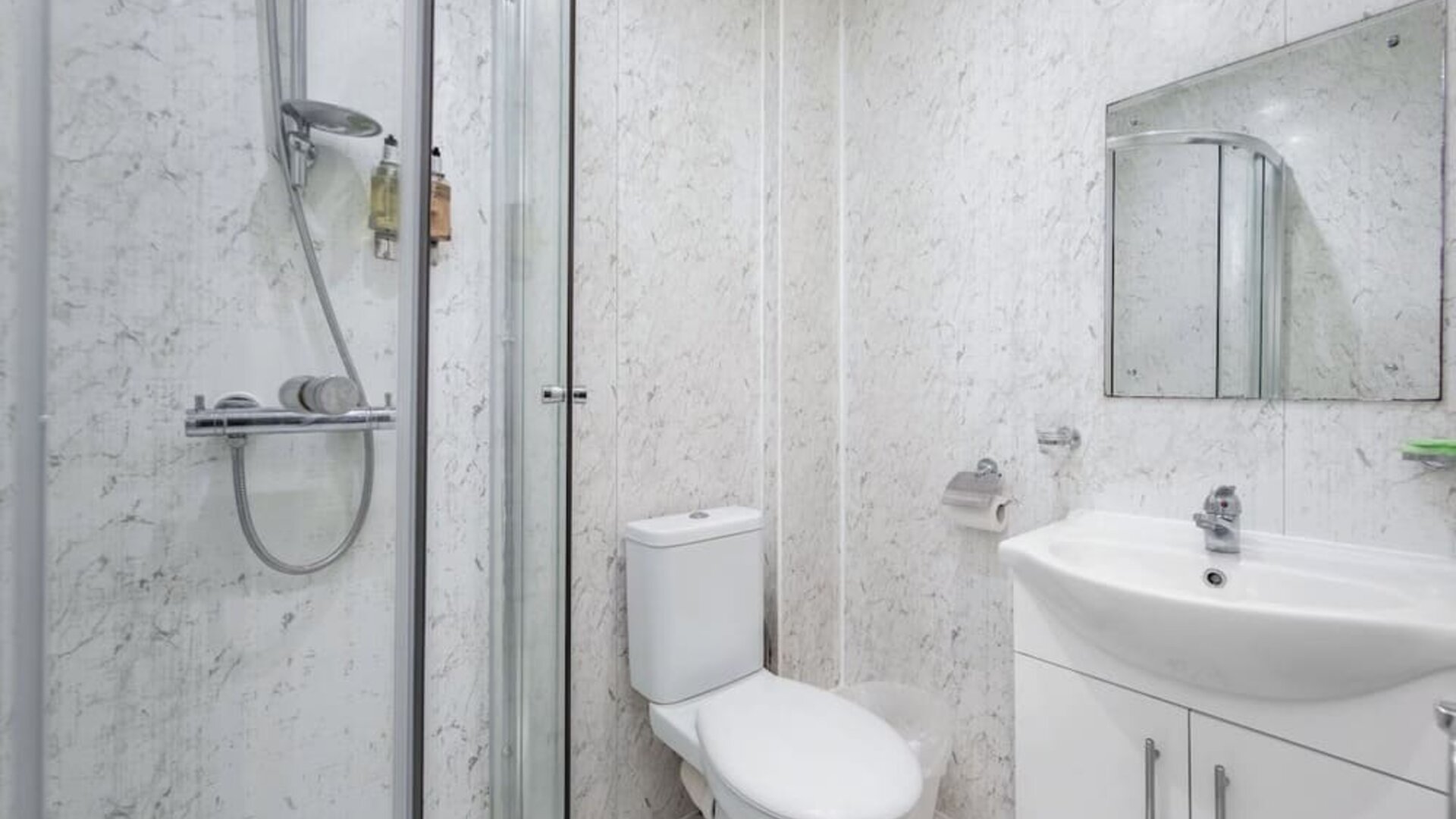 Private guest bathroom with shower and free toiletries at King Solomon Hotel.