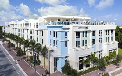 Hotel exterior at Courtyard Delray Beach.
