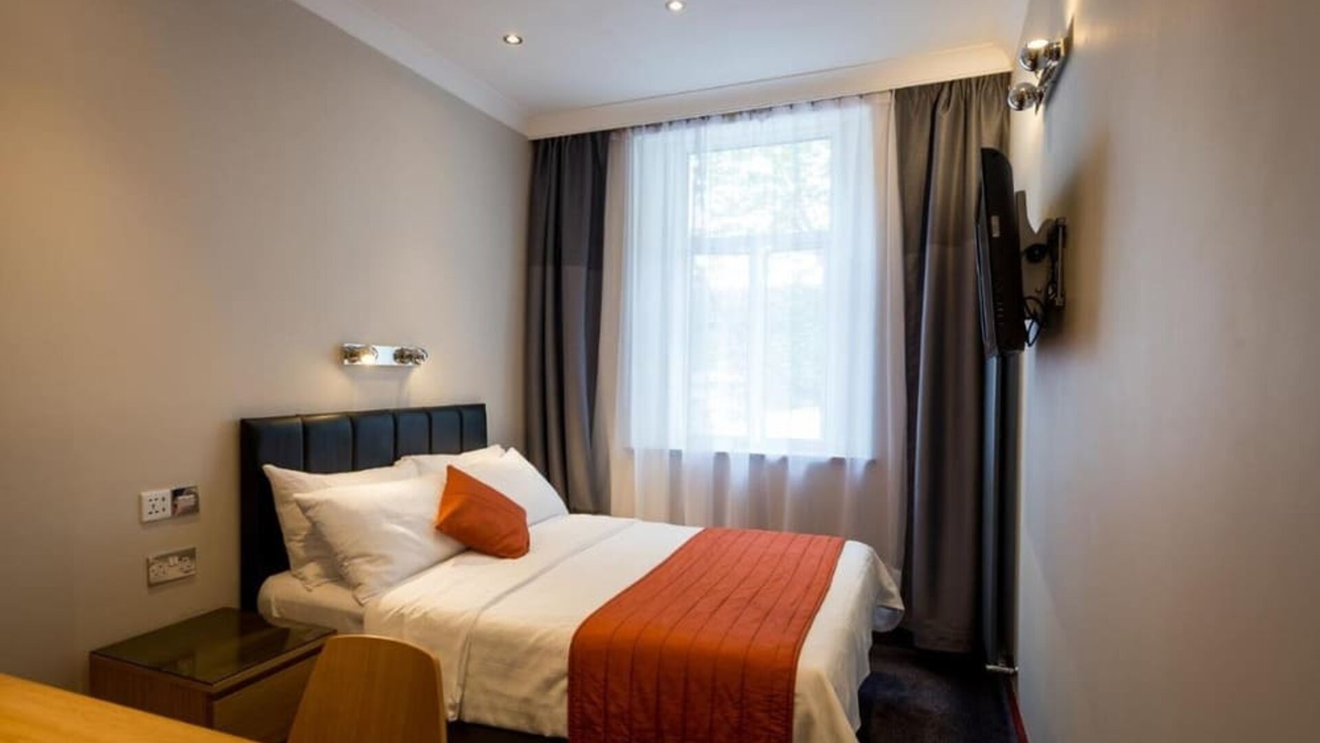 Day use room with big window and work desk at Adria Hotel.