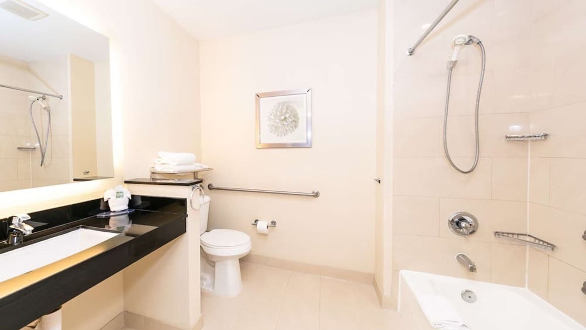 Guest bathroom with shower at Best Western San Diego Zoo/SeaWorld Inn & Suites.