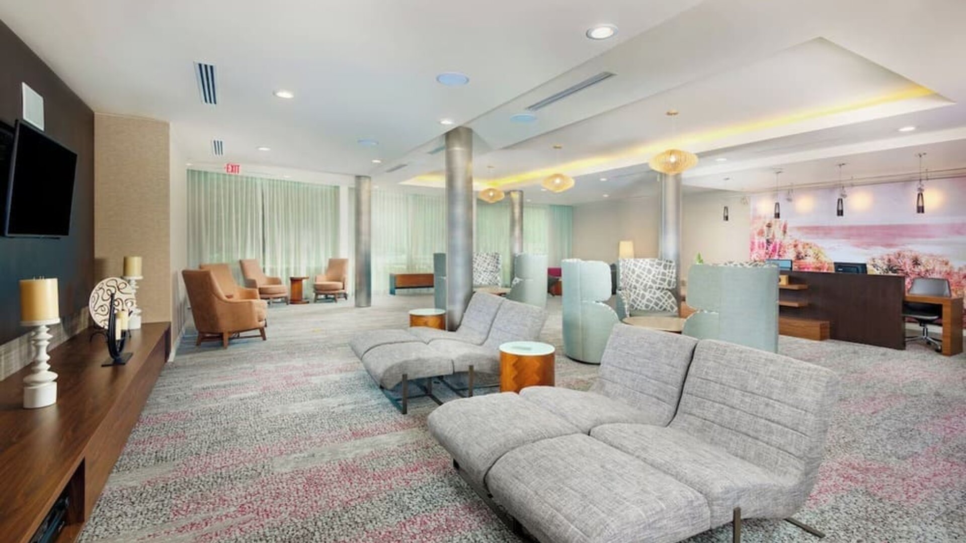 Lobby and coworking lounge at Courtyard By Marriott Santa Ana Orange County.