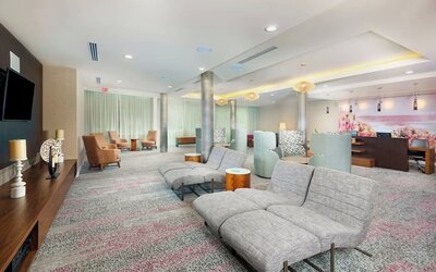 Lobby and coworking lounge at Courtyard By Marriott Santa Ana Orange County.