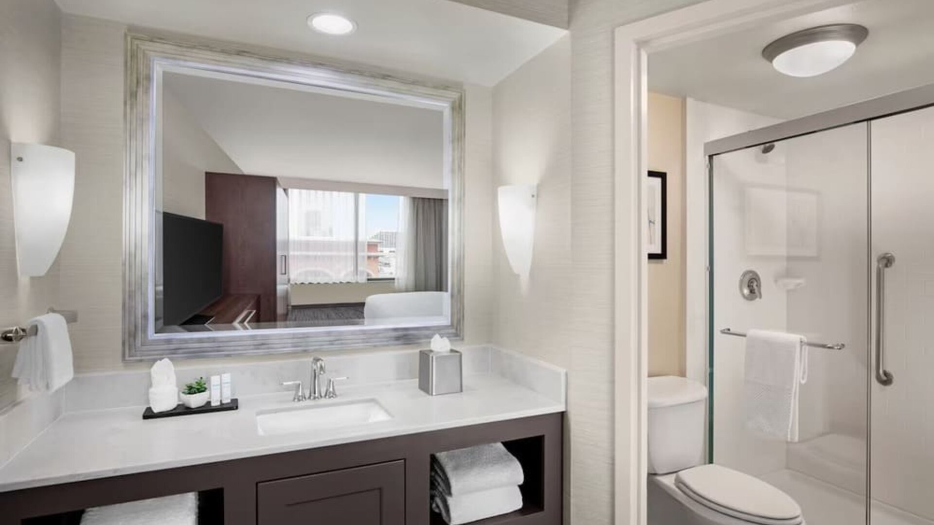 Guest bathroom with shower at Embassy Suites San Antonio.