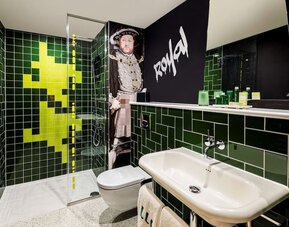 Guest bathroom with shower at nhow London.