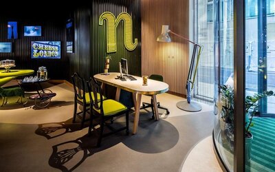 Business center with computer and ergonomic chairs at nhow London.