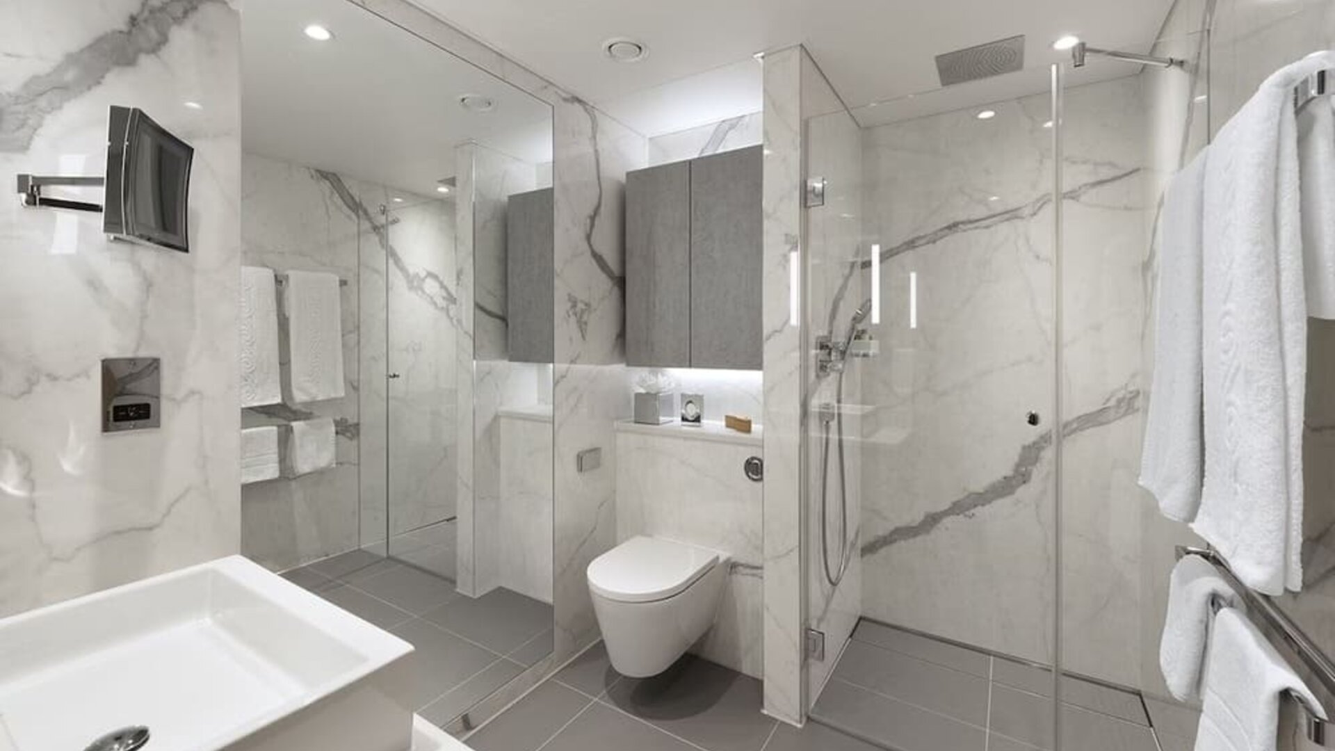 Guest bathroom with shower and guest bathroom at Tower Suites Hotel by Blue Orchid.