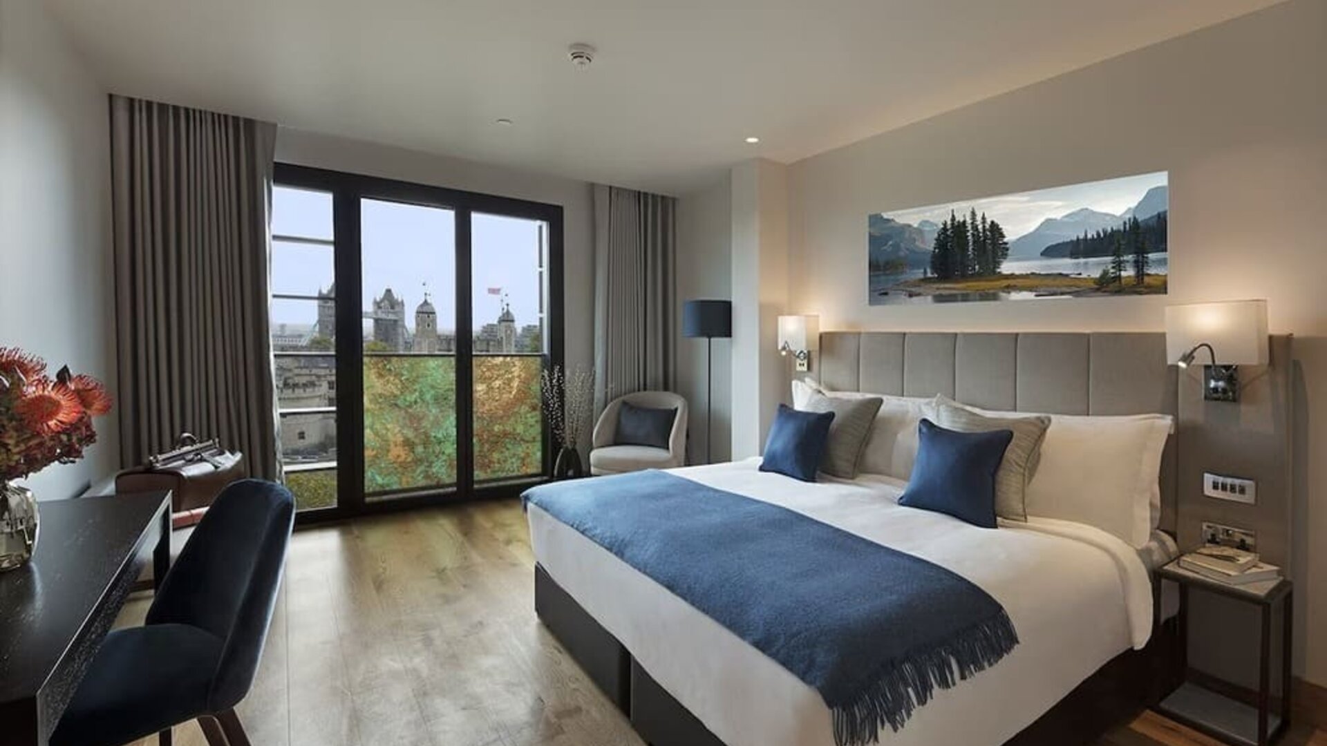 Day use room with floor to ceiling window and work desk at Tower Suites Hotel by Blue Orchid.