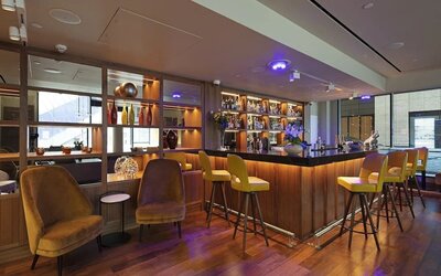 Hotel bar and lounge area at Tower Suites Hotel by Blue Orchid.