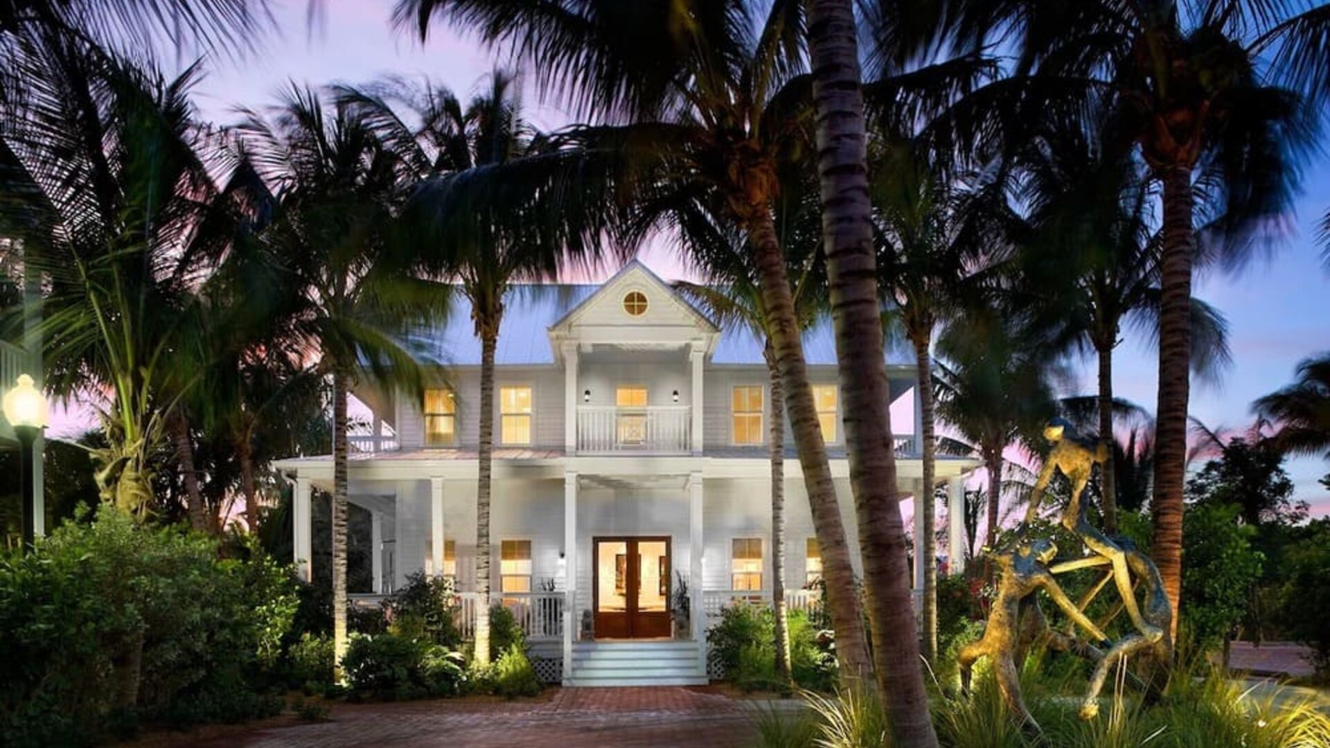 Hotel exterior at dusk at Parrot Key Hotel & Villas.
