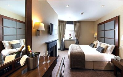 Day use queen room with work desk and fireplace at The Wellington by Blue Orchid Hotel (FKA The Rochester).