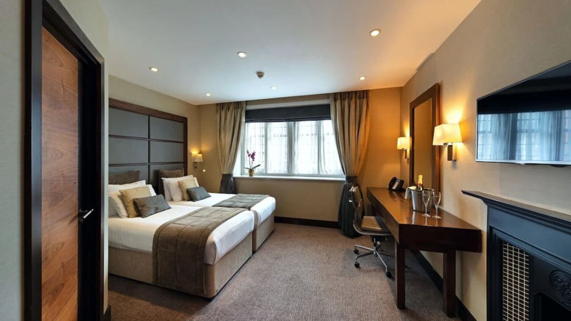 Bright and spacious day use room with work desk and fireplace at The Wellington by Blue Orchid Hotel (FKA The Rochester).