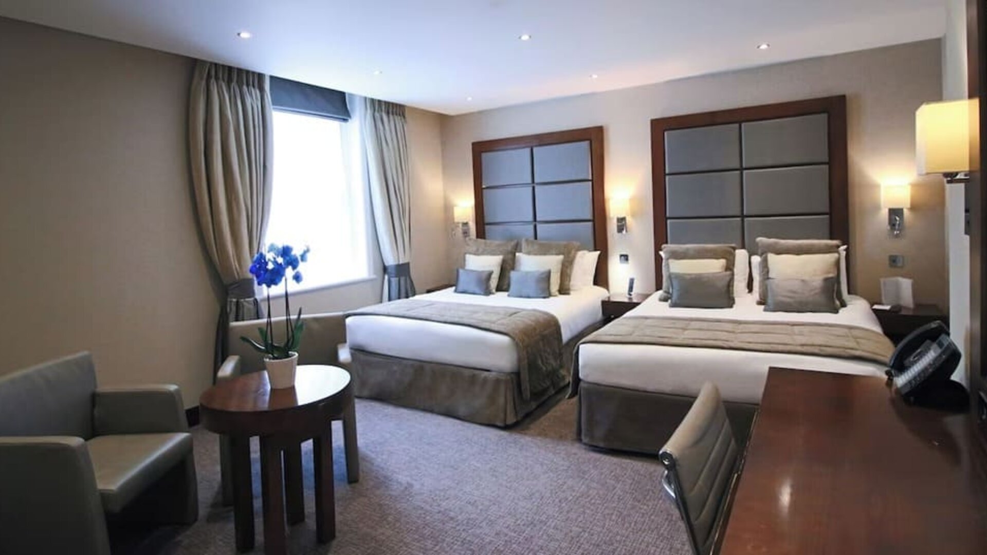 Day use twin room with work desk and lounge area at The Wellington by Blue Orchid Hotel (FKA The Rochester).