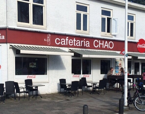 Exterior view with seating at Hotel Chao 24/7.