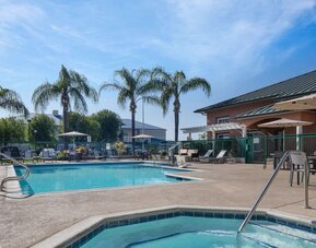 Refreshing outdoor pool and spa tub at Residence Inn Santa Clarita.