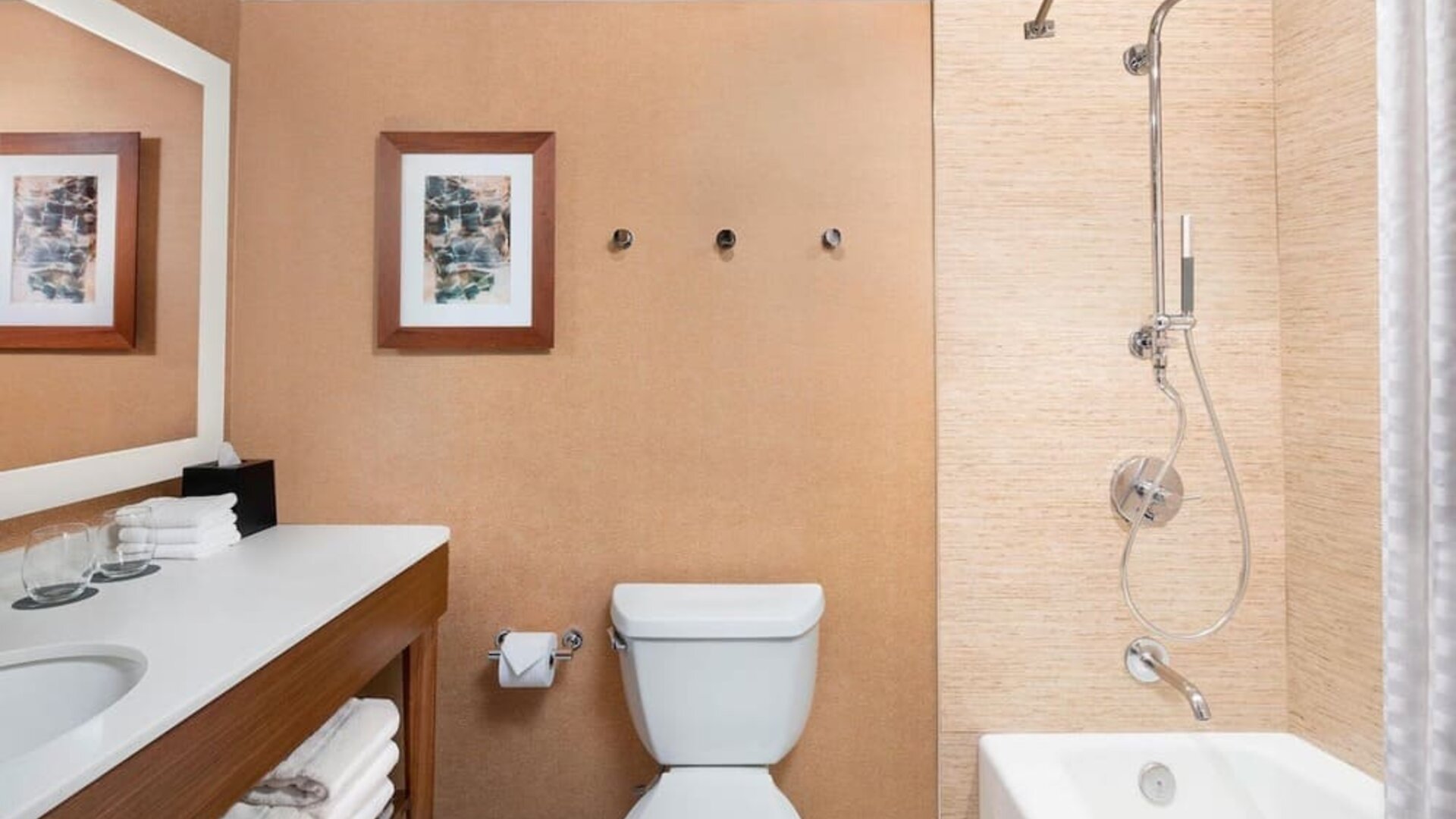 Guest bathroom with shower and tub at The Westin Crystal City Reagan National Airport.