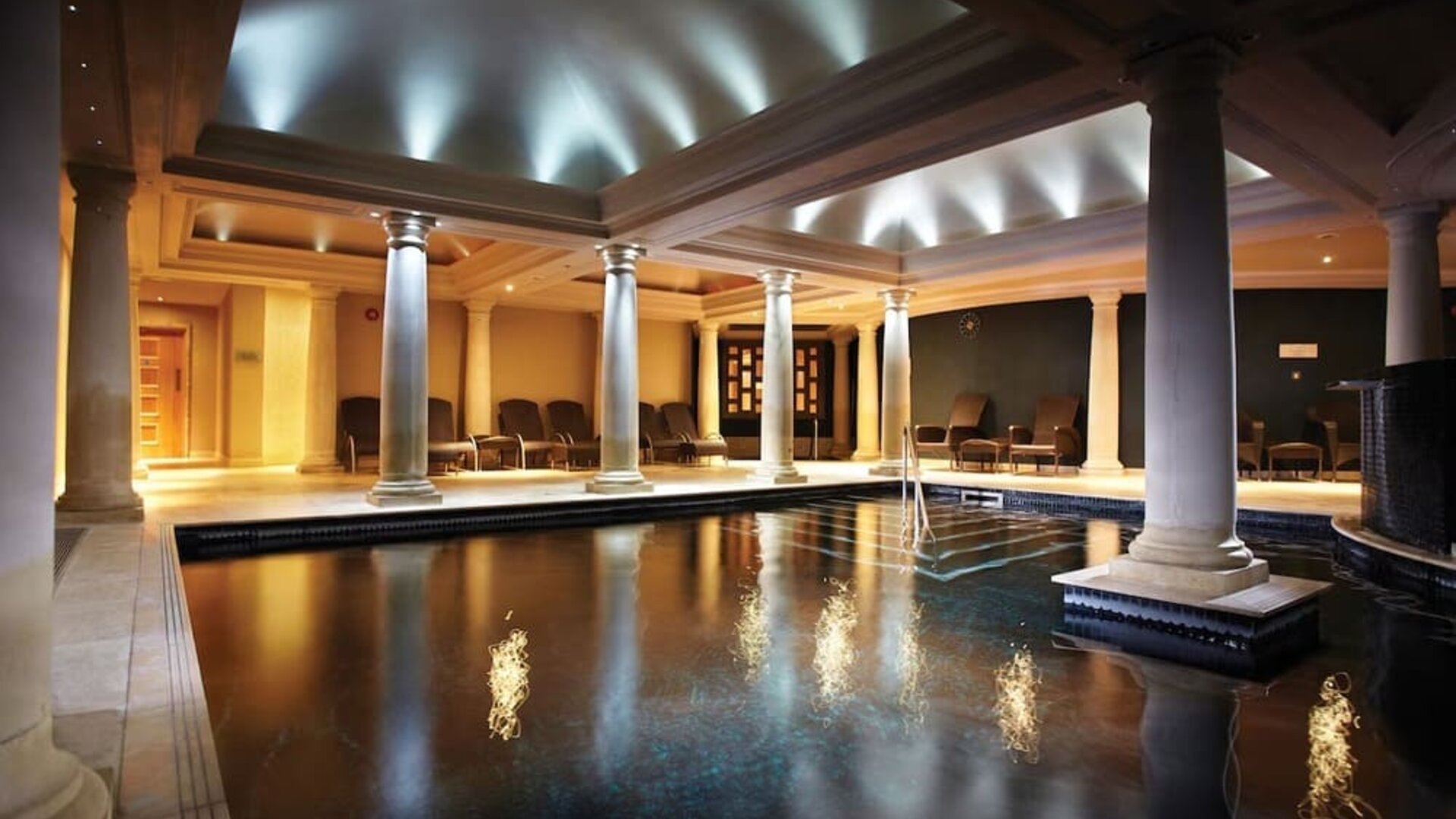 Indoor heated pool with lounge area at Alexander House Hotel And Utopia Spa Hotel.