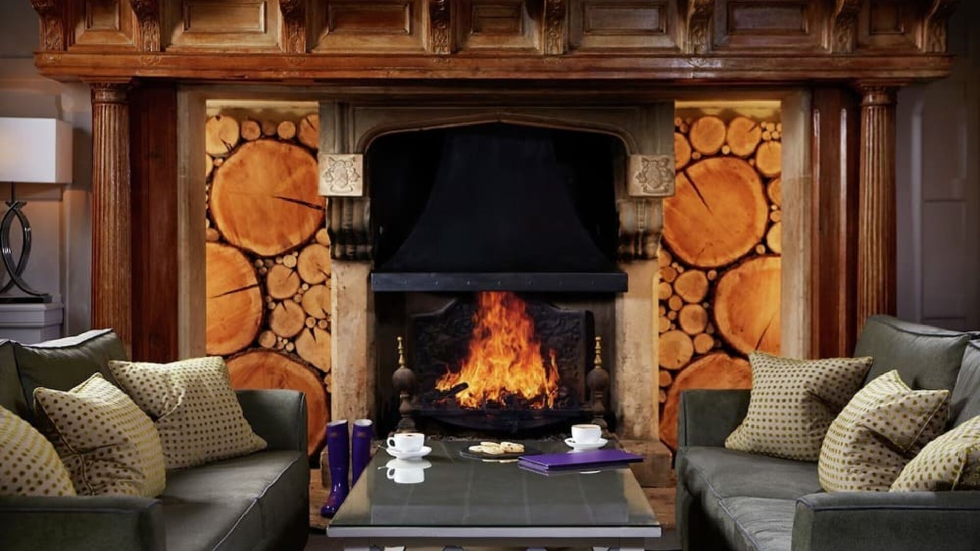 Lounge area with fireplace at Alexander House Hotel And Utopia Spa Hotel.
