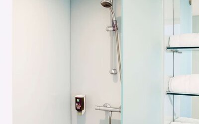 Guest bathroom with shower at Ibis Styles Crewe.